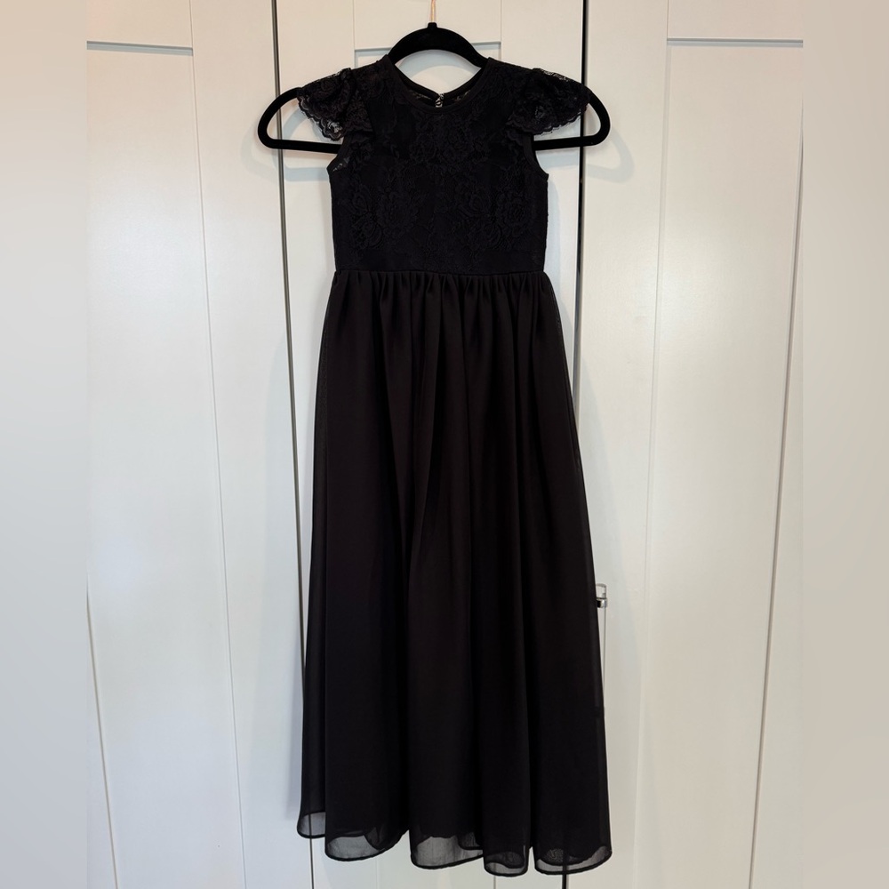 Girls all black long formal dress. No tag. Size 7-8. Worn one time.